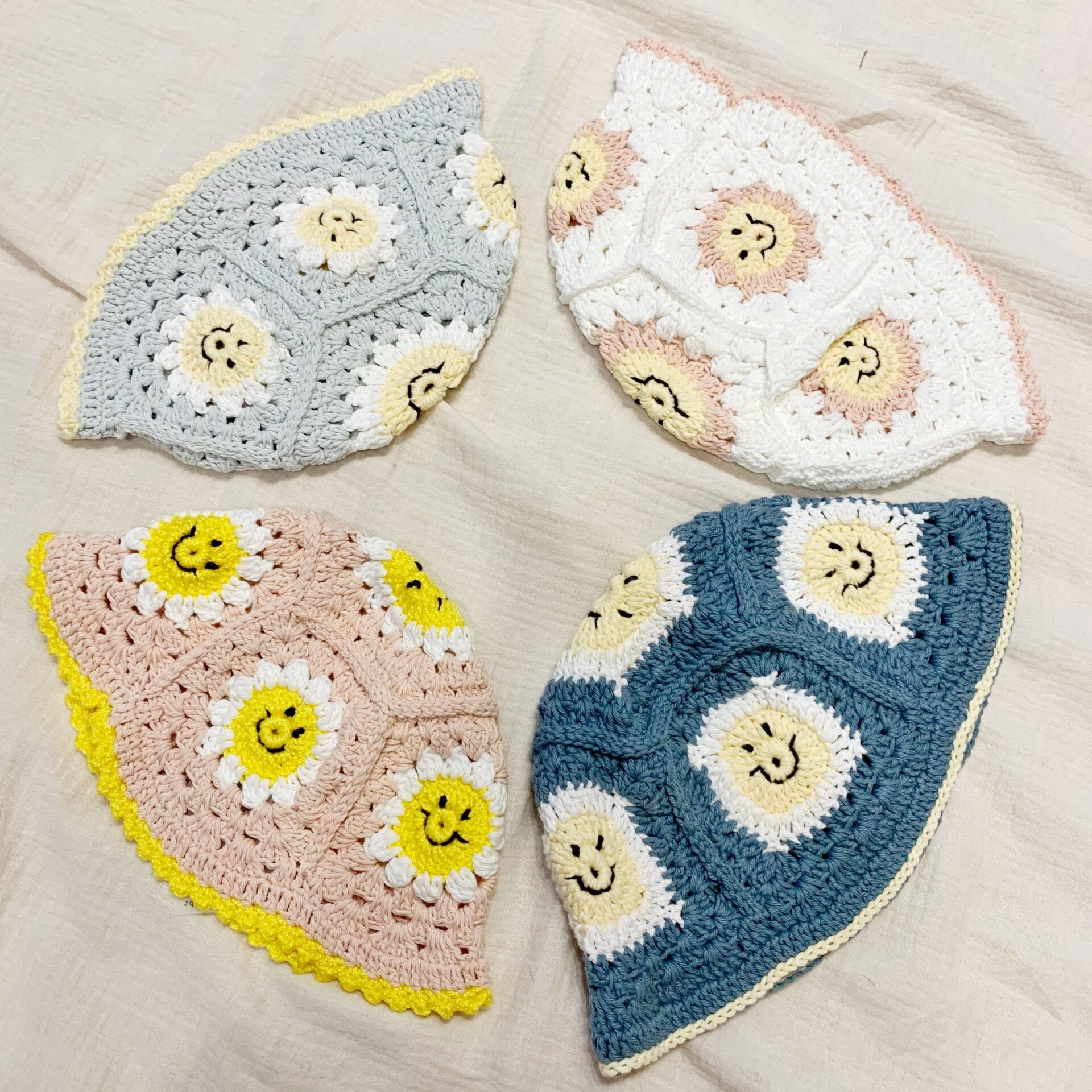 Smiley crochet hat in light blue and 
